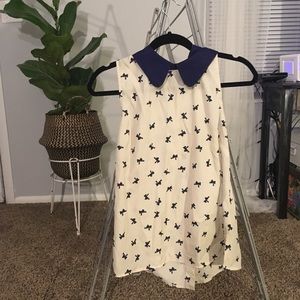 Sleeveless blouse with bow print